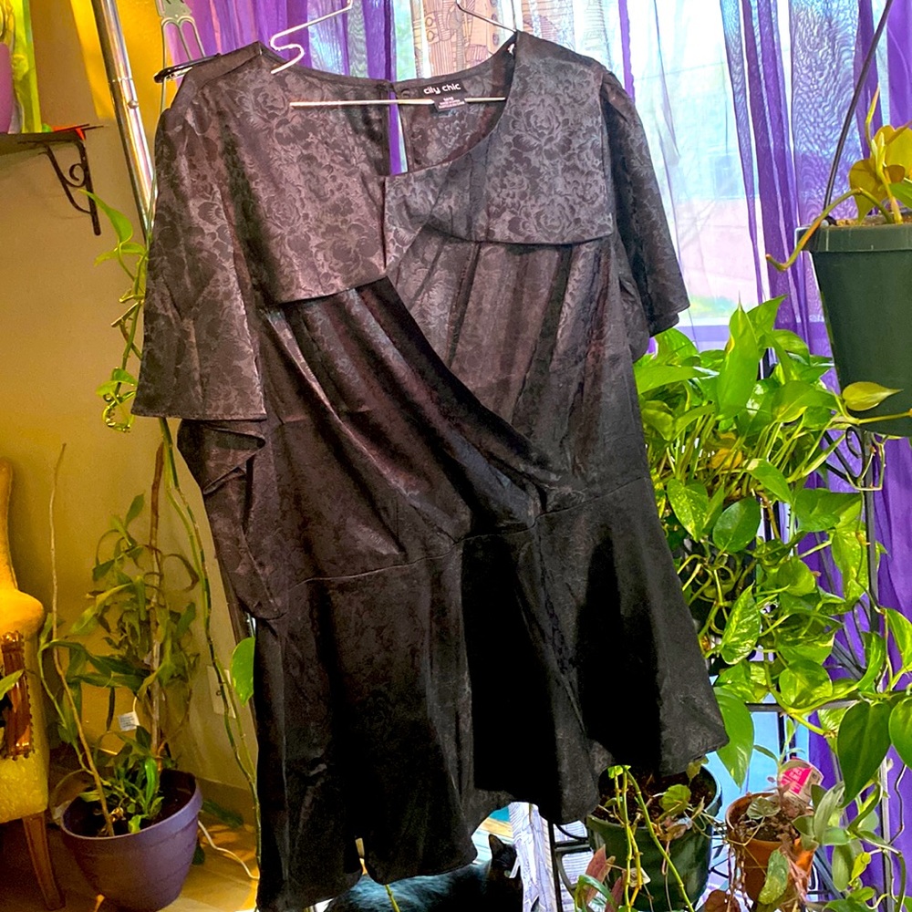 Satin style faux wrap with chest cut out. Size 18